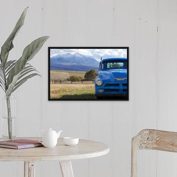 "USA, Colorado, Carbondale, Blue vintage car, mount Sopris in